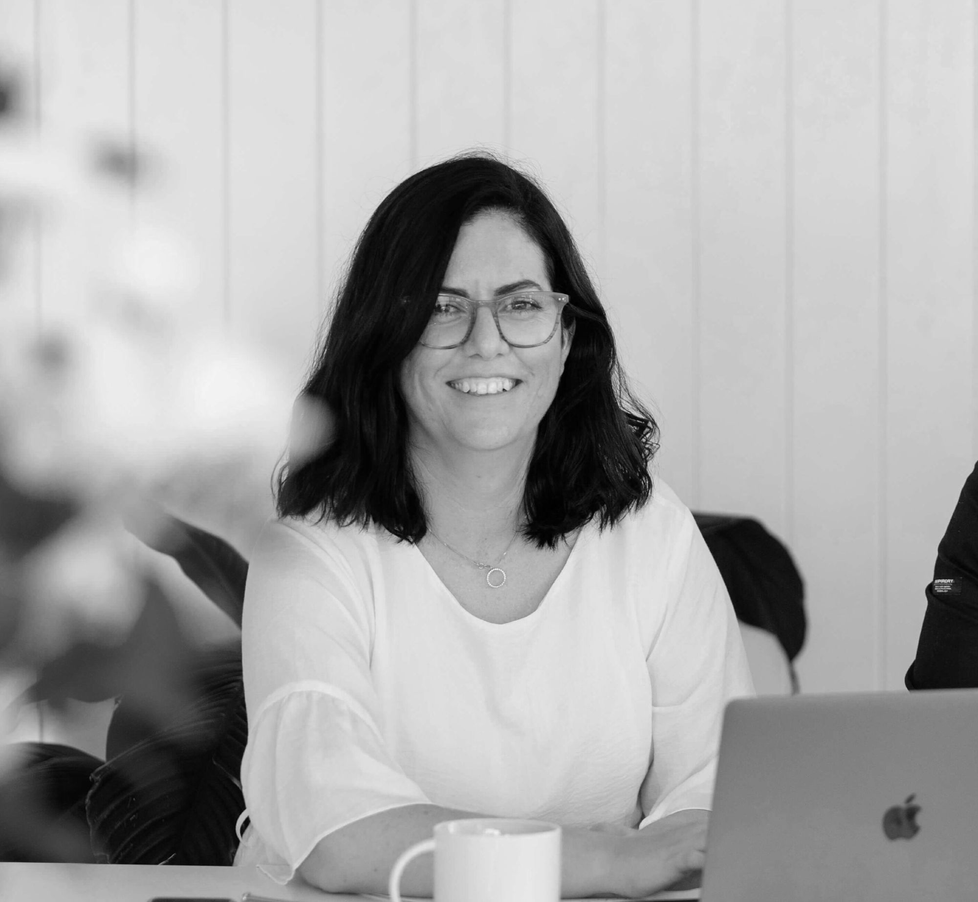 decorative image of a business woman with a macbook